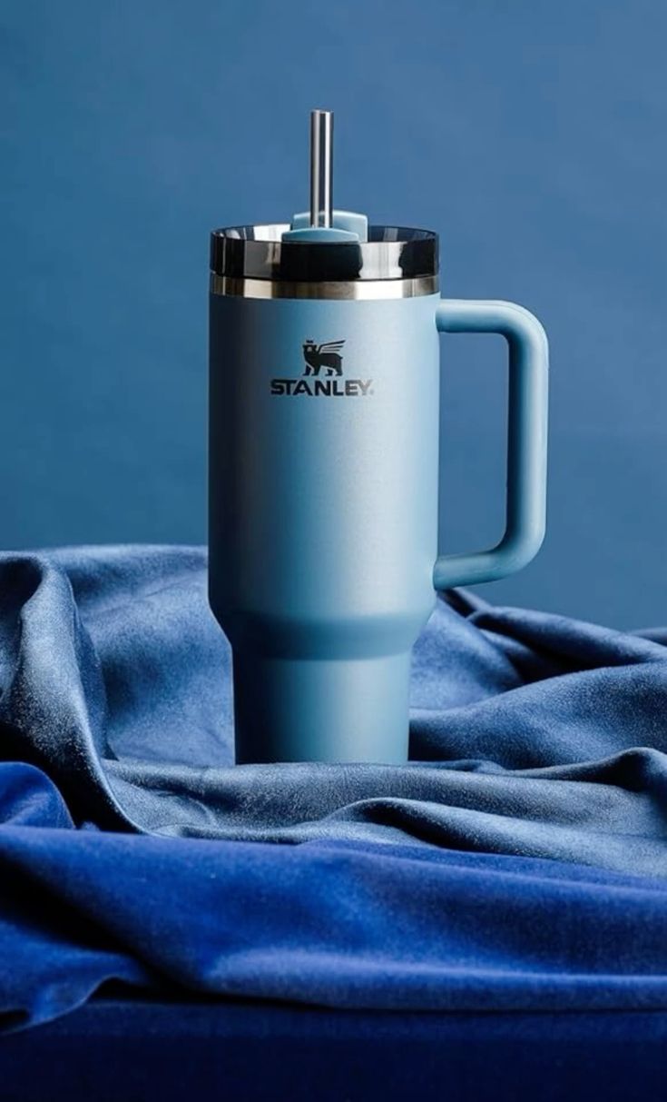 Stanely Tumbler mugs with straw.